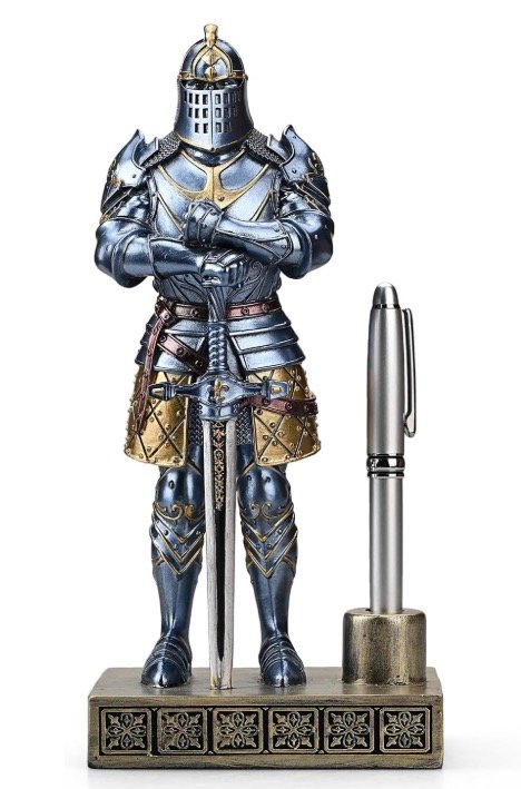 Medieval knight figurine pen holder in blue-steel and gold armor with a broadsword and integrated pen cup holding a silver pen.