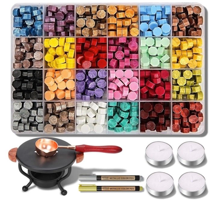 Wax seal stamp kit with a 24-color bead organizer, black melting furnace, copper spoon, metallic color pens, and tea light candles.