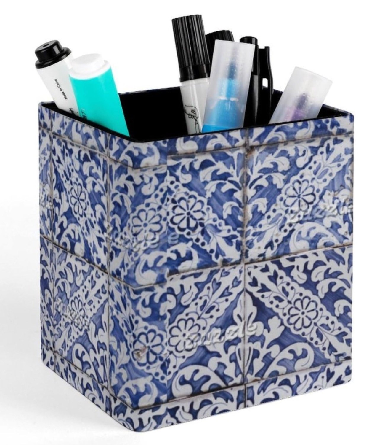 Cube-shaped faux leather pen holder with blue and white Portuguese azulejo tile print, shown holding pens and markers on a white background.