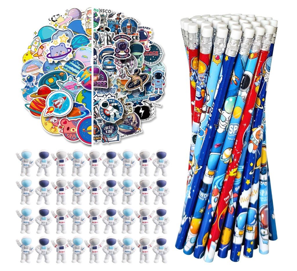 Outer space theme party favor stationery set with galaxy-wrapped pencils, cute and retro space stickers, and small astronaut figurines arranged on a white background.